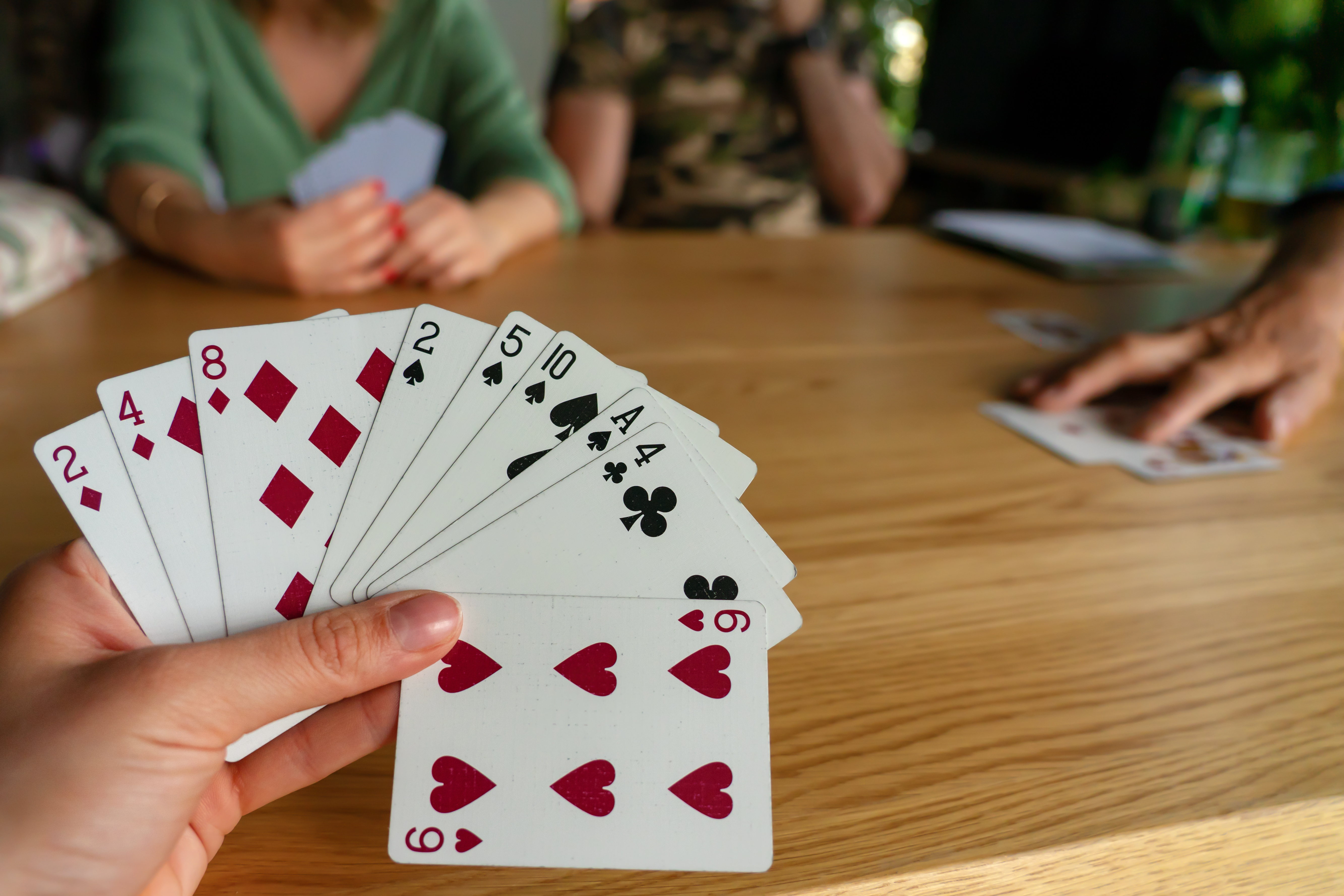 Somebody's playing cards are shown as a game is happening